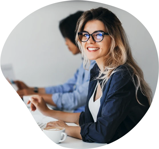 Pylogix software developer smiling during a planning session with her team
