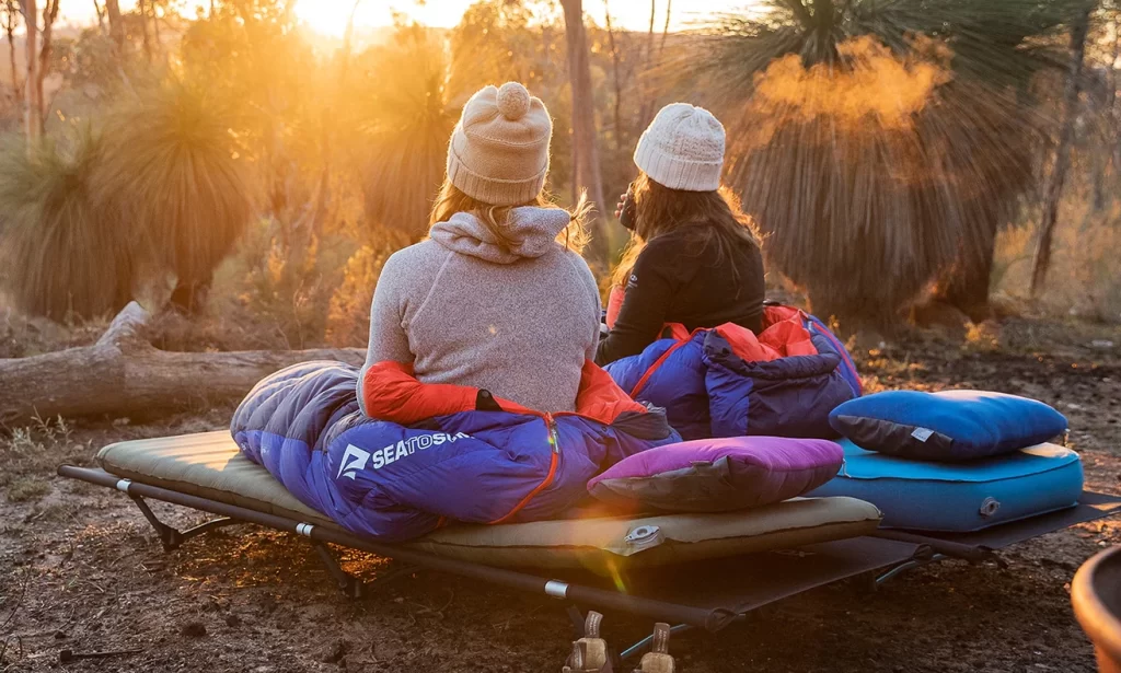 Two campers with Sea to Summit sleeping gear at sunset